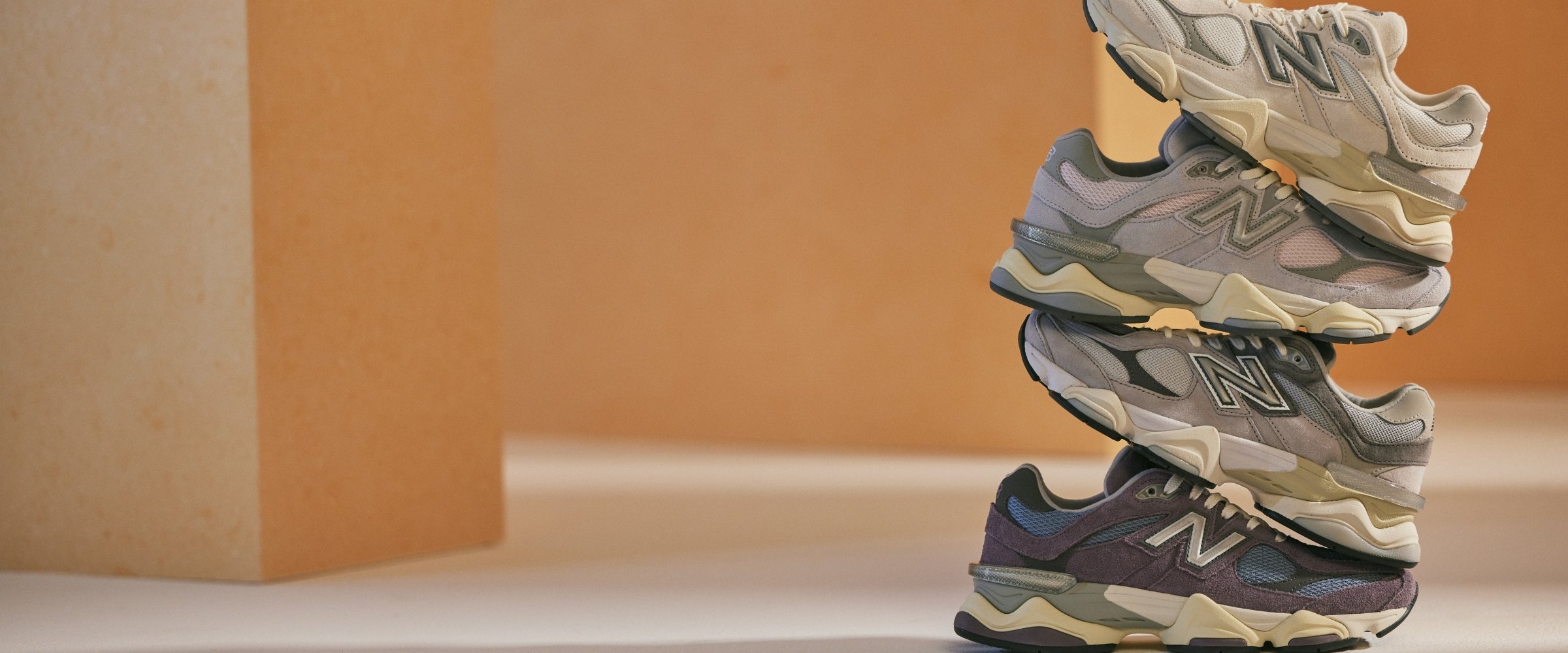 Pairs of New Balance 9060 stacked