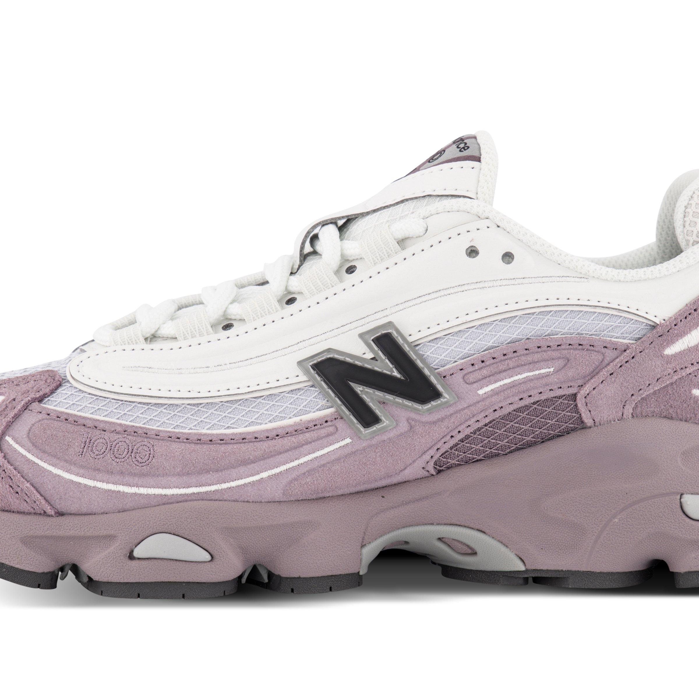 Close up of Single New Balance 1000 Sneaker in Navy & White Pointing left outside view