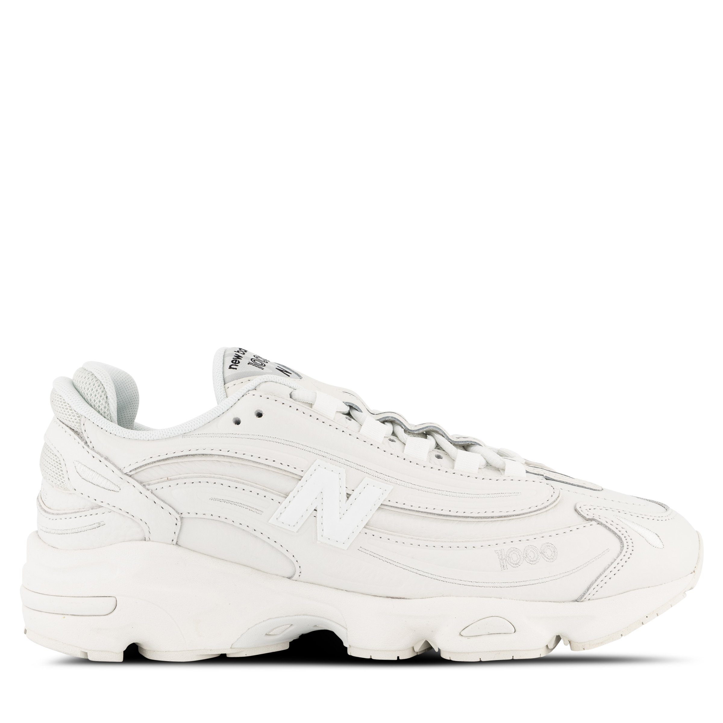 Single New Balance 1000 Sneaker in All White Pointing right outside view