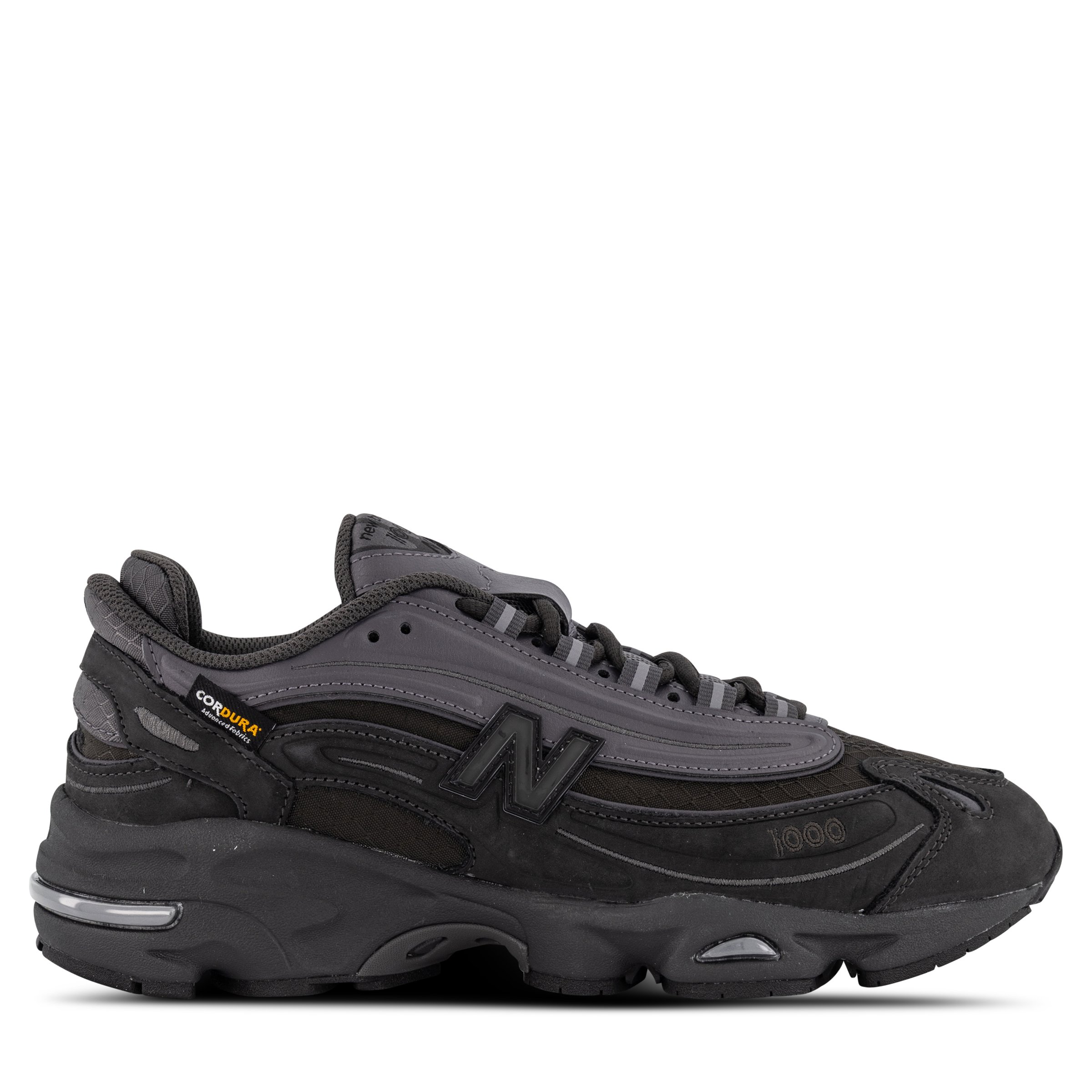 Single New Balance 1000 Sneaker in Black Cement Pointing right outside view