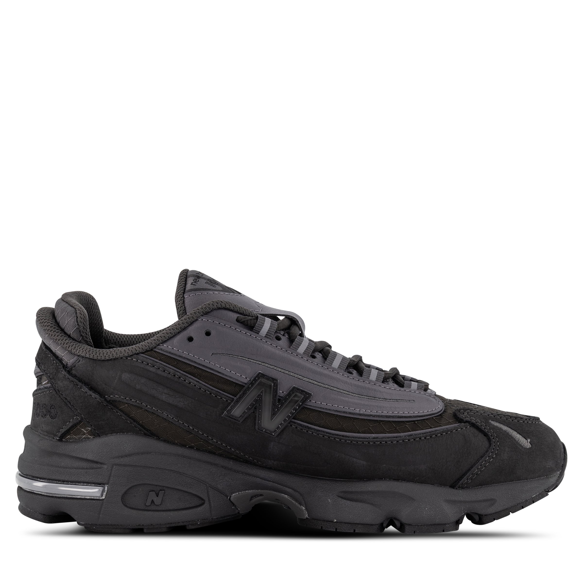 Single New Balance 1000 Sneaker in Black Cement Pointing right inside view