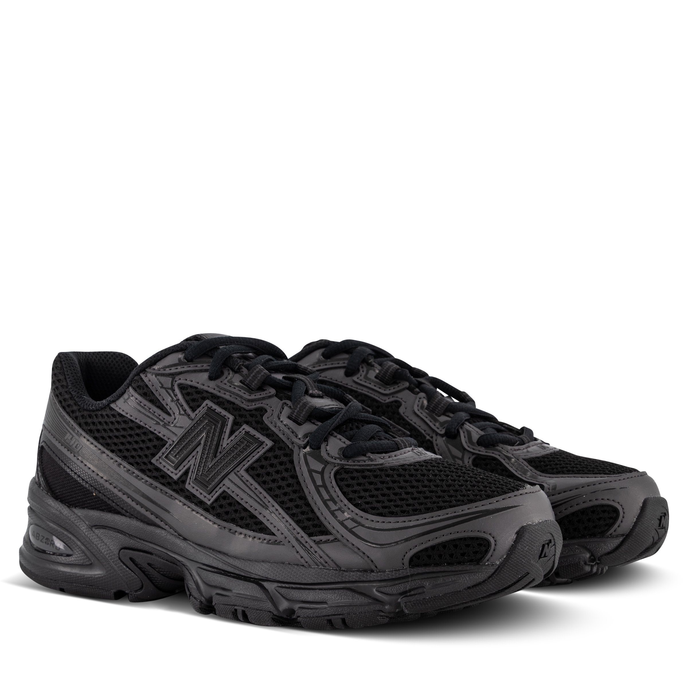 New Balance 740 sneakers in Black Cement angled right
